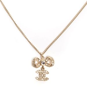 CHANEL Crystal CC Bow Necklace Light Gold 2014P